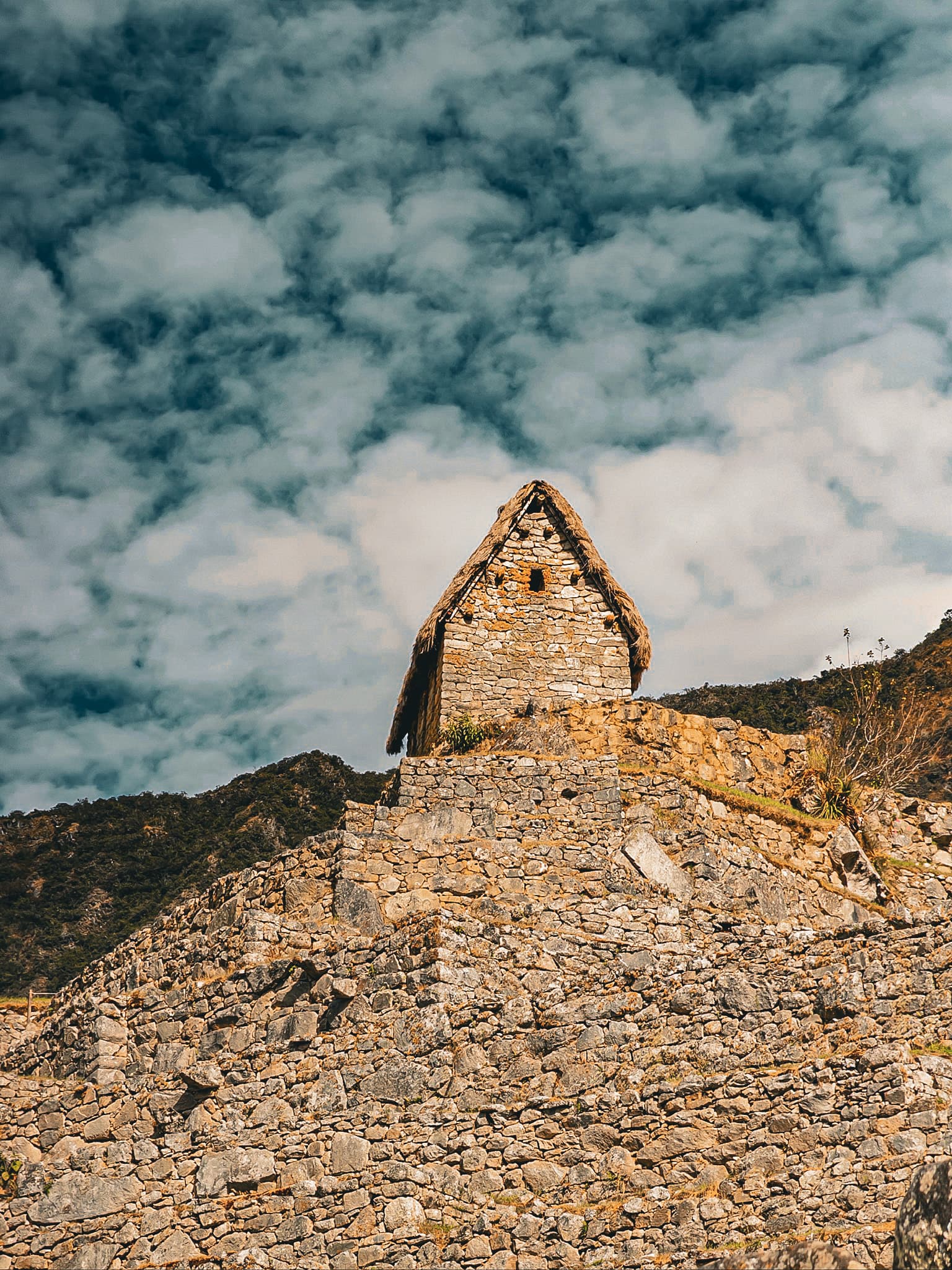 An Inca stone building against the sky at Machu Picchu